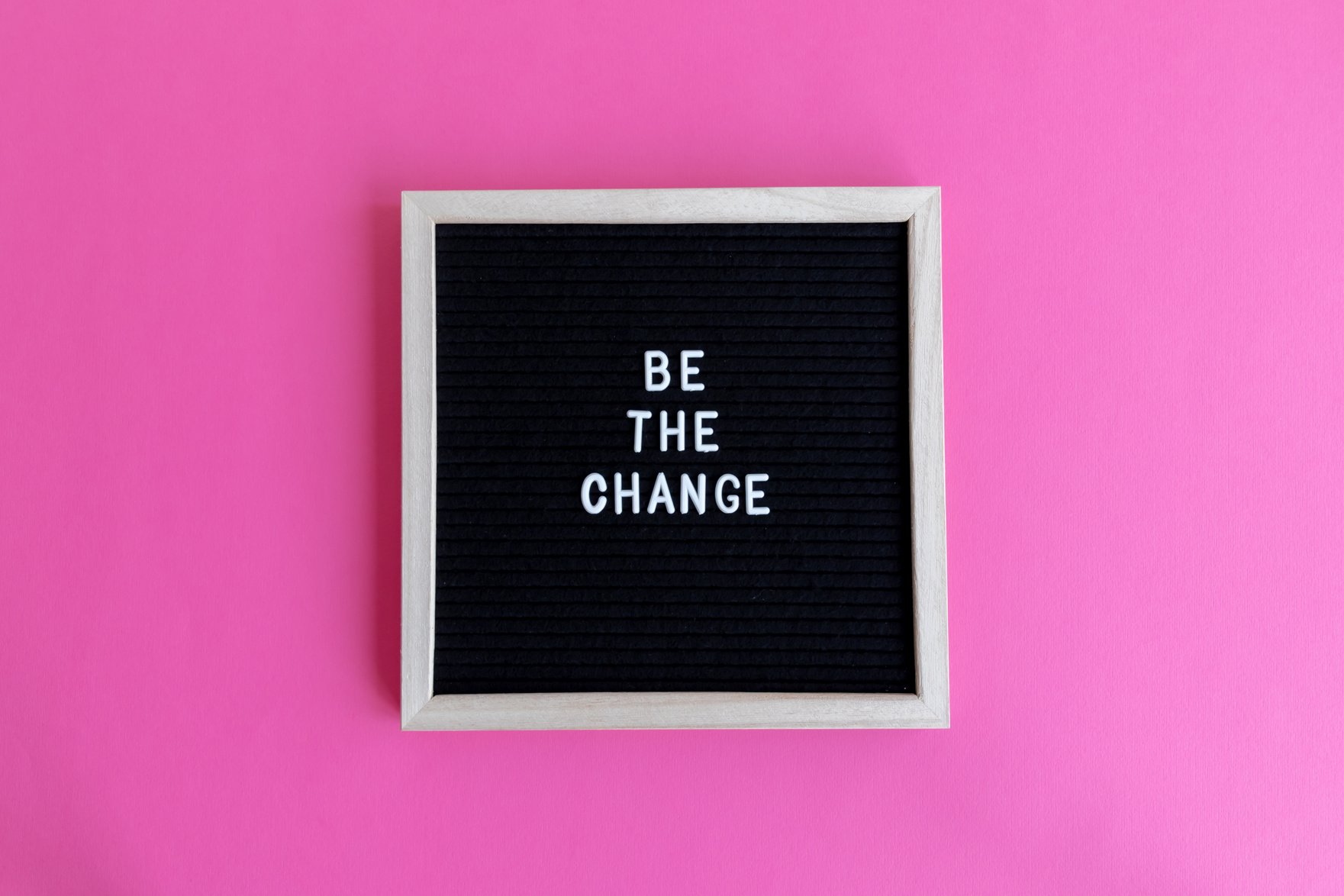 Inspirational Words in Frame on Pink Background